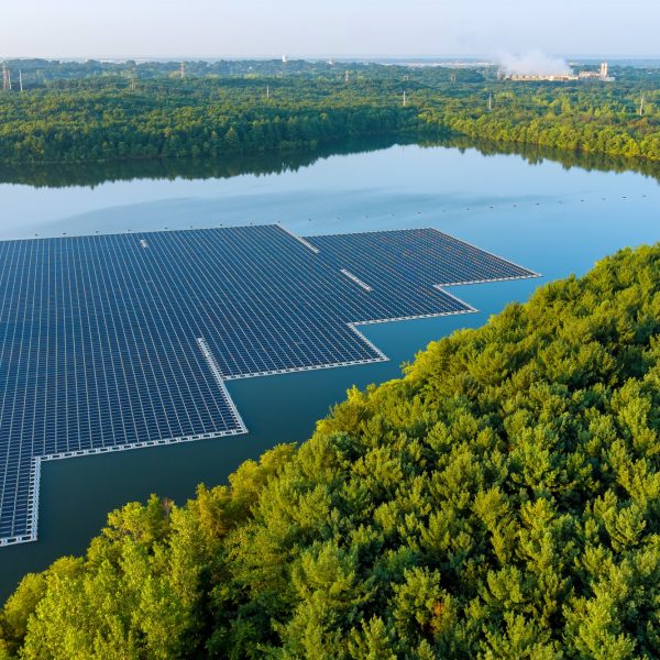 Aerial view of environmentally friendly energy with floating solar panels platform system on the lak